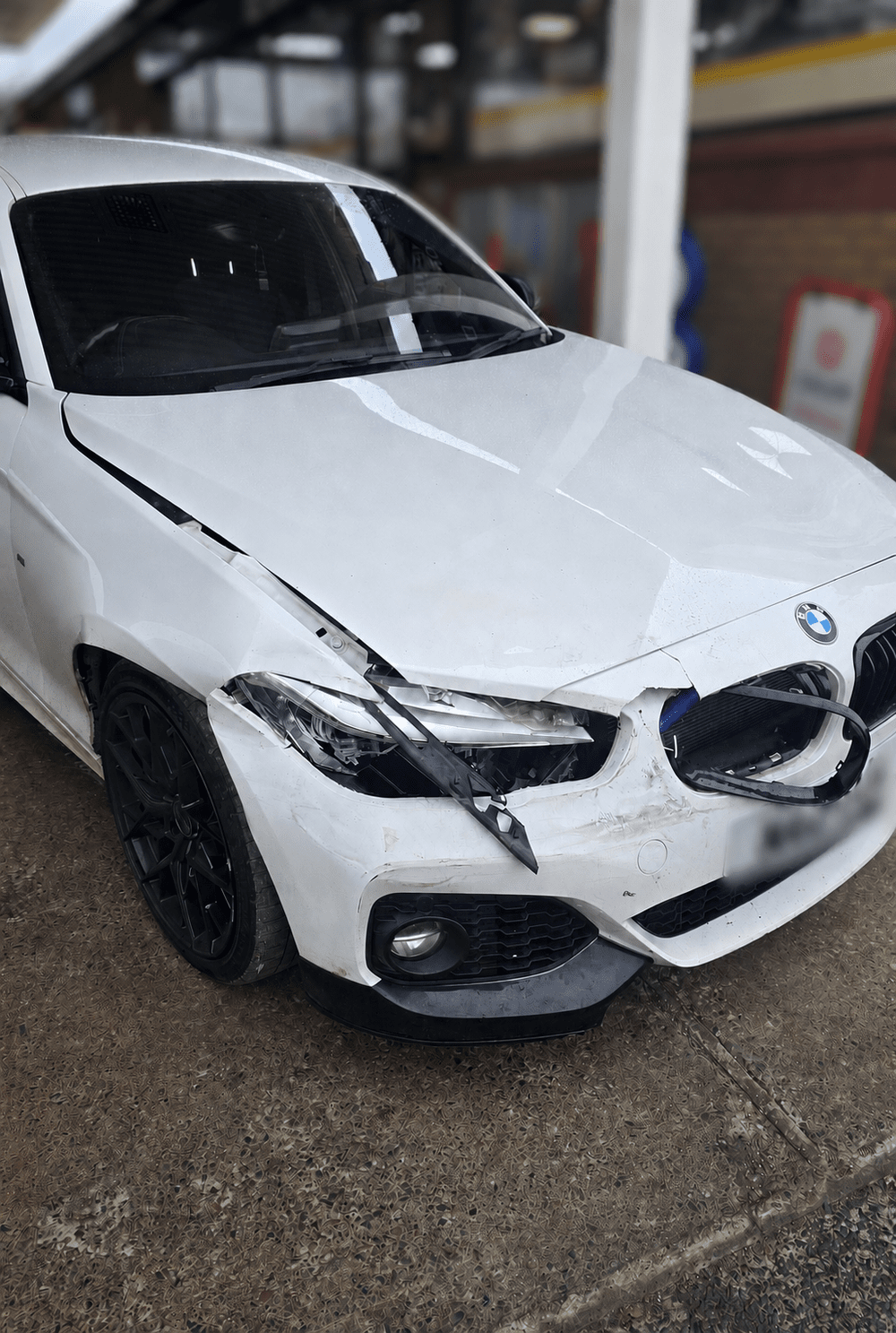 White BMW with front-end accident damage, shown on the original Better Call Mo website